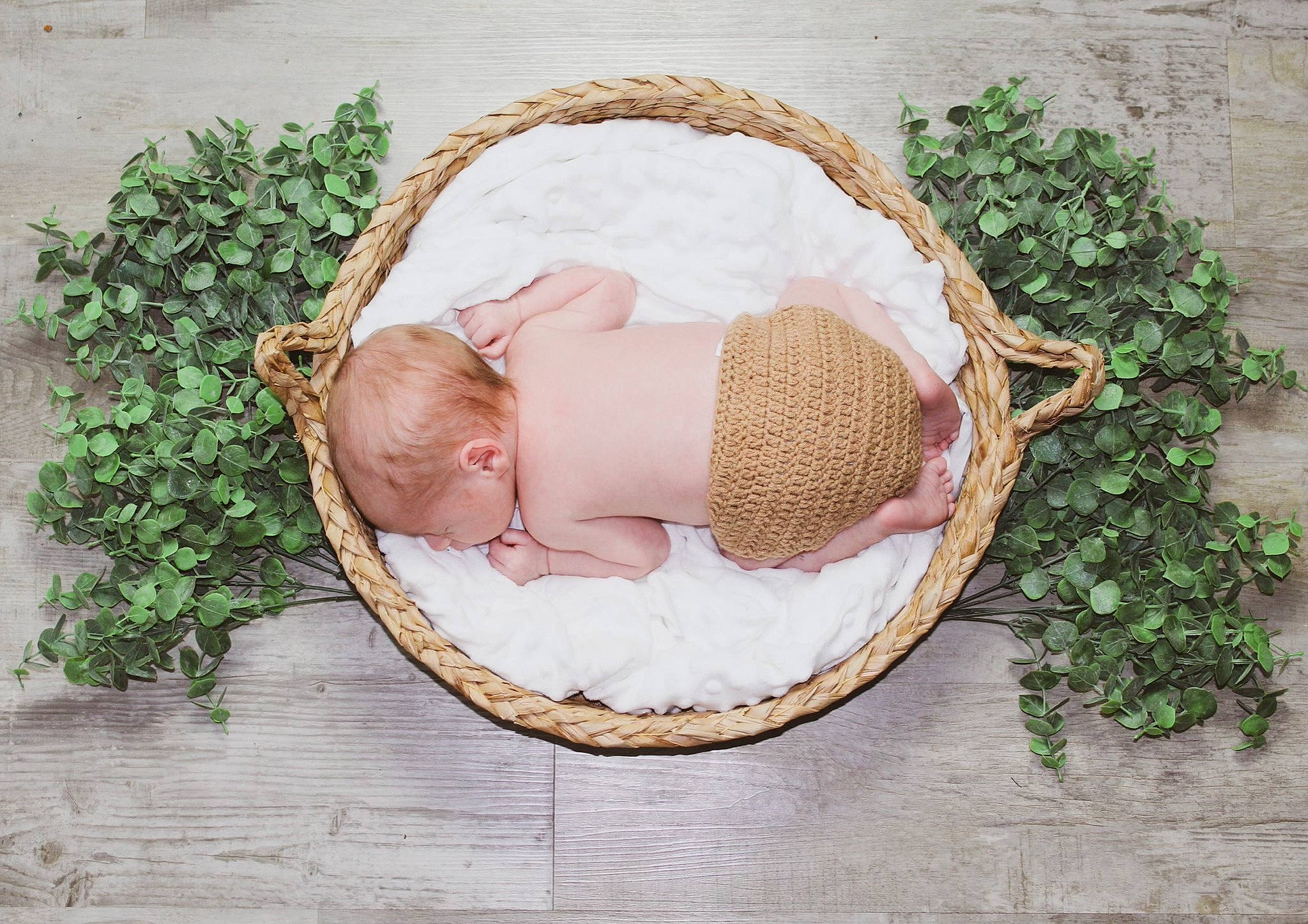 Layton is registered to the contest to win money with this photo: baby, baby_products, baby_sleeping, baby_toddler_clothing, basket, child, comfort, fashion_accessory, grass, hair_accessory, headgear, jewellery, linens, outdoor_furniture, person, plant, portrait_photography, sitting, toddler, wicker