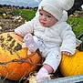 autumn, baby, child, cloudy_sky, cute, fall, field, grass, hand, hat, nature, outdoor, person, pom_pom_hat, portrait, pumpkin, seasonal, sitting, soft_texture, white_clothing