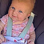 baby, child, infant, car_seat, blanket, pink_clothing, blue_eyes, smile, face, skin, hand, hair, seatbelt, cute, indoors, portrait, closeup, soft_light, happy, young