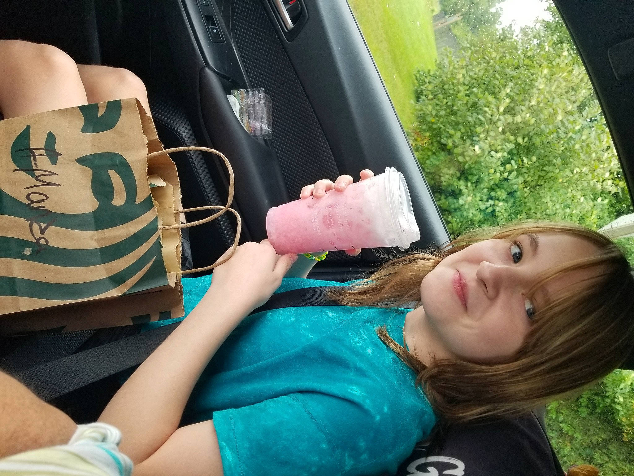 Maddison is registered to the contest to win money with this photo: auto_part, cool, elbow, family_car, finger, food, fun, gesture, grass, hand, happy, joy, leisure, motor_vehicle, person, plant, sitting, summer, thigh, thumb