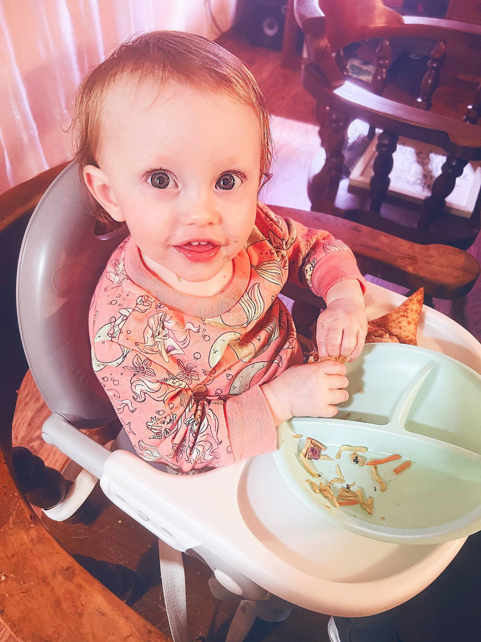 Jemma is registered to the contest to win money with this photo: baby, baby_toddler_clothing, chair, cheek, child, cup, dishware, drinkware, food, food_craving, person, pink, plate, porcelain, serveware, sitting, smile, spoon, table, tableware