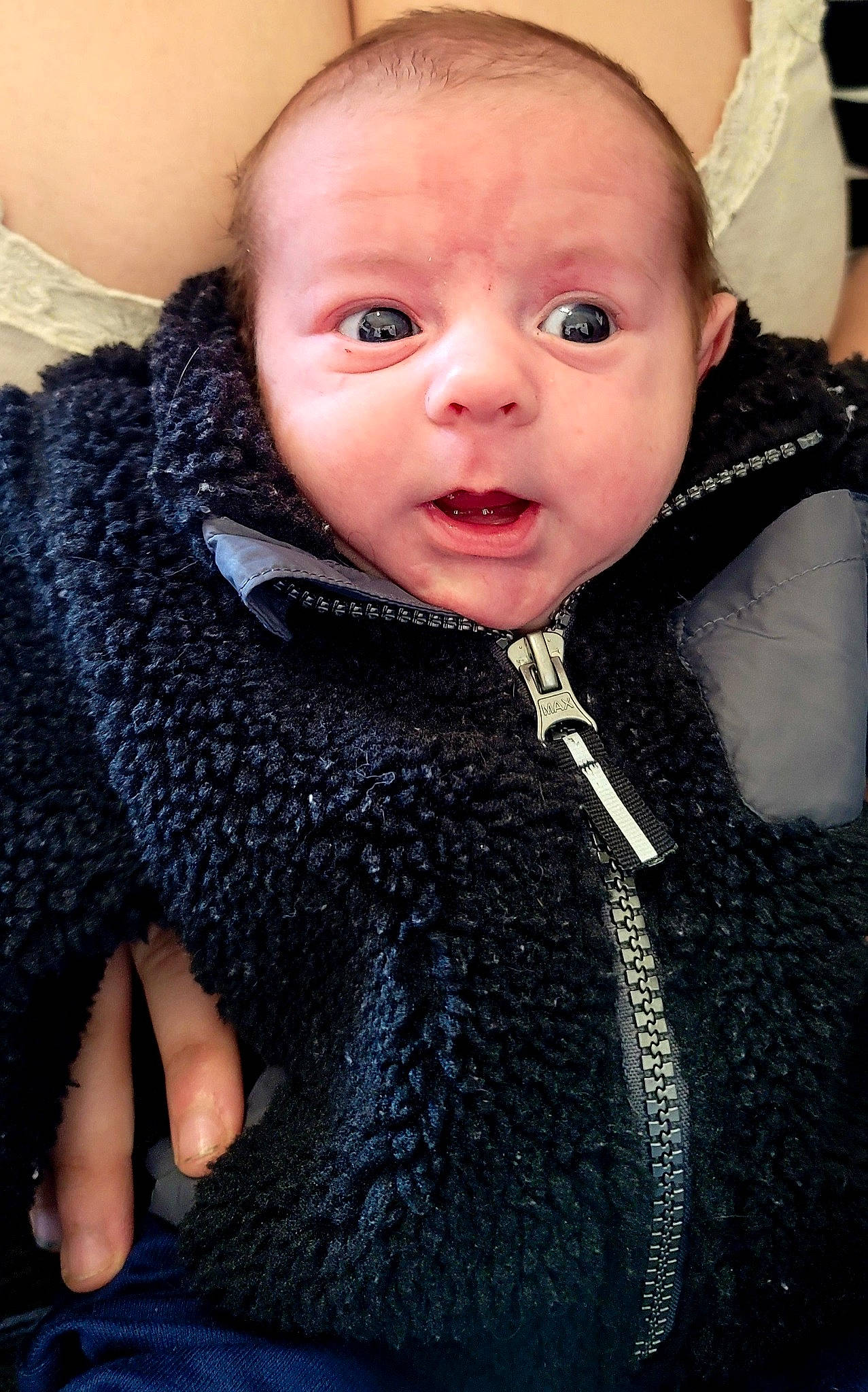 Ean is registered to the contest to win money with this photo: baby, baby_toddler_clothing, cheek, electric_blue, eyelash, fashion_accessory, finger, gesture, happy, iris, jacket, jewellery, lip, person, shawl, skin, sleeve, stole, textile, toddler