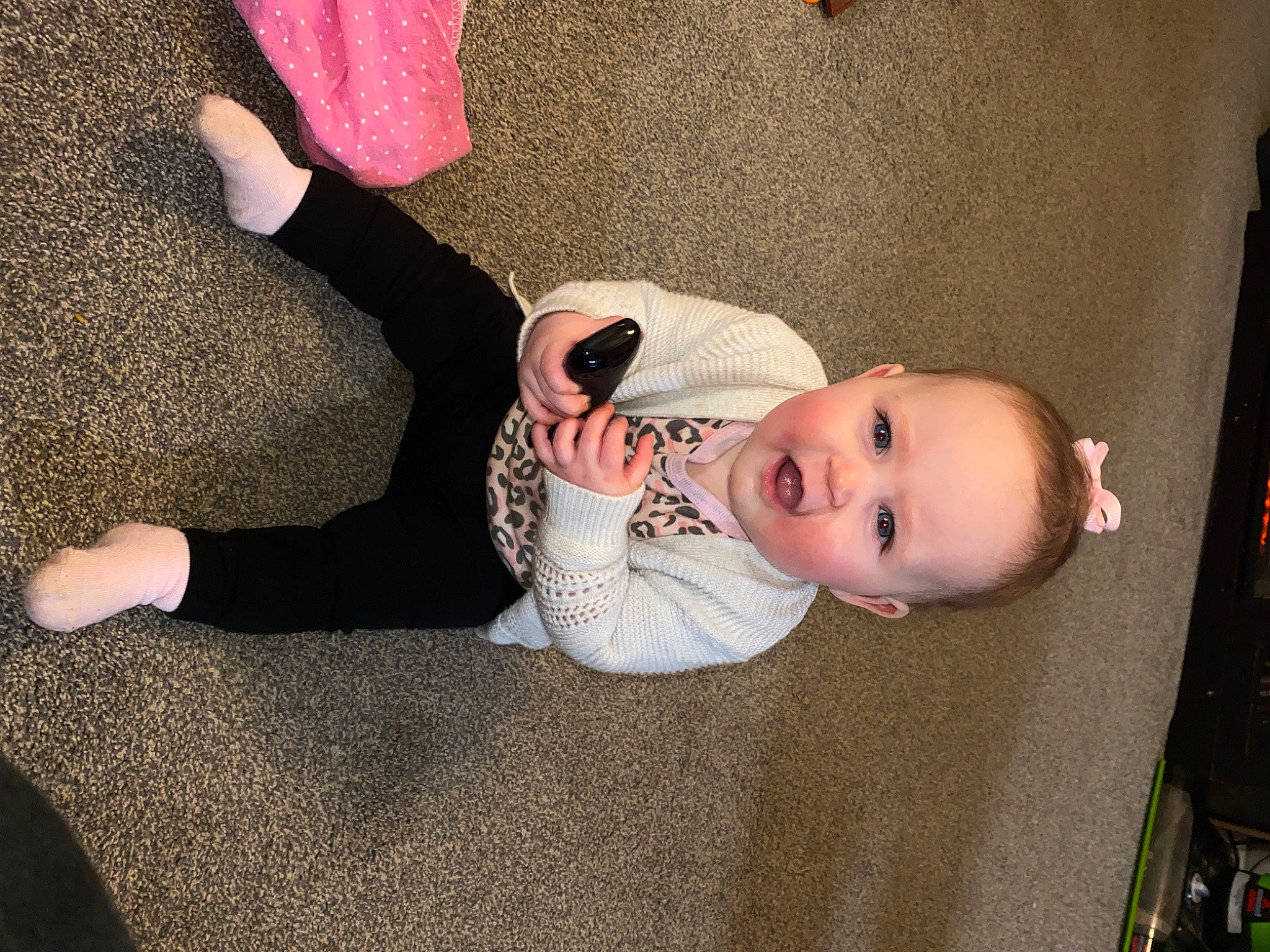 Brinlee is registered to the contest to win money with this photo: baby, baby_toddler_clothing, cheek, child, comfort, finger, floor, flooring, headgear, human_body, human_leg, leg, person, pink, sitting, skin, sleeve, smile, textile, toddler
