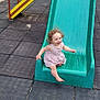 Giulya a rejoint le concours — aidez-le/la à gagner de superbes lots ! barefoot, child, curly_hair, dress, fun, green_slide, happy, joy, outdoor, park, play, playground, recreation, safety_mats, slide, smiling, summer, sunny, toddler, young_child