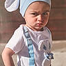 toddler, child, baby, hat, blue, white_shirt, bunny, suspenders, cute, portrait, expression, serious, outdoor, sunlight, hands_on_hips, clothing, person, face, young_child, costume