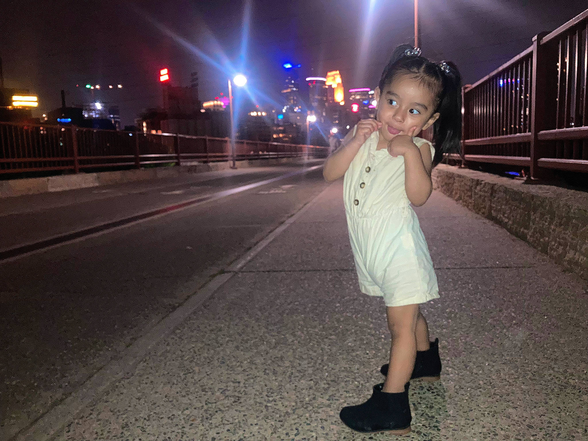 Aubrianna is registered to the contest to win money with this photo: asphalt, automotive_lighting, city, dress, electric_blue, electricity, eyewear, flash_photography, human_leg, infrastructure, lighting, midnight, pedestrian, person, road, road_surface, sidewalk, sky, standing, street_light