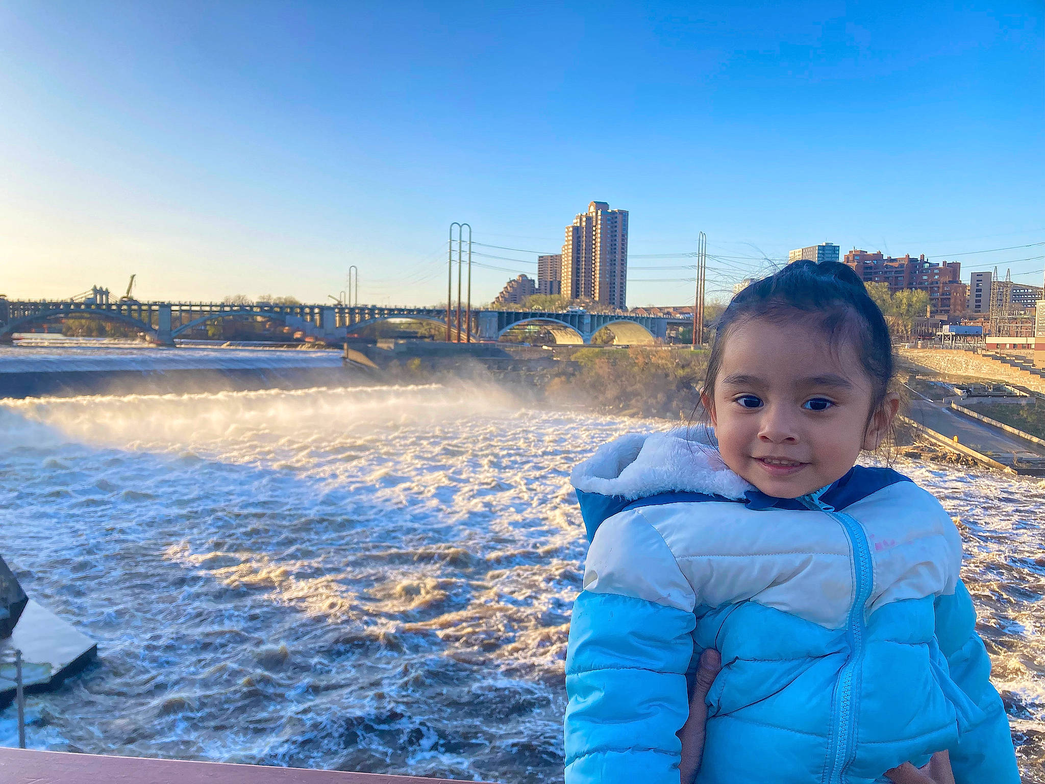 Aubrianna is registered to the contest to win money with this photo: baby, baby_toddler_clothing, blue, city, cloud, dusk, electric_blue, freezing, fun, happy, horizon, joy, leisure, meteorological_phenomenon, ocean, person, recreation, sky, toddler, tower