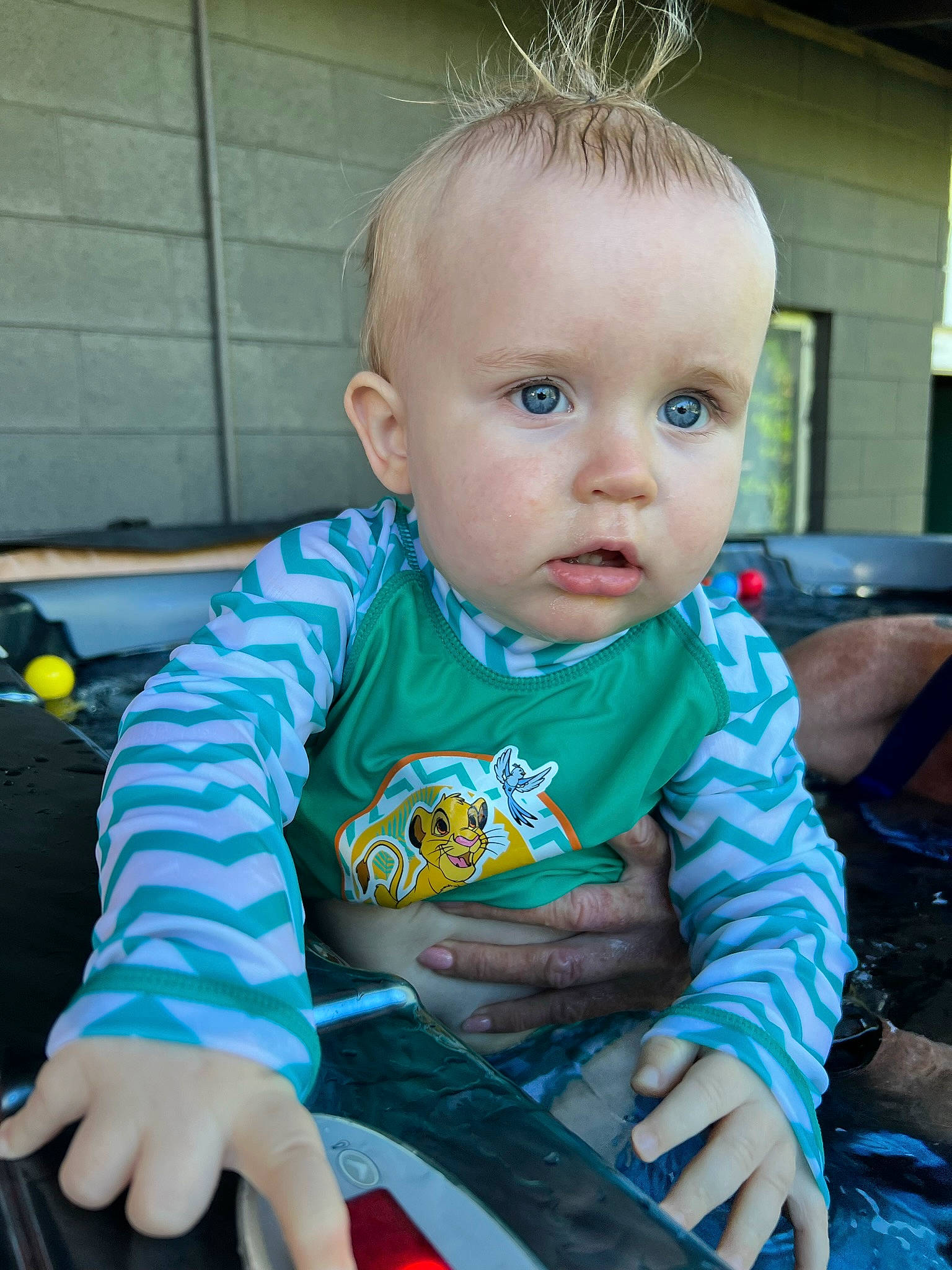 Ryder is registered to the contest to win money with this photo: baby, baby_products, baby_toddler_clothing, chair, child, electric_blue, face, fun, grass, happy, head, lap, leisure, luggage_and_bags, person, play, recreation, sitting, t_shirt, toddler