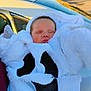 Aloni is registered to the contest to win money with this photo: baby, black, car, child, costume, cute, face, fluffy, hooded, infant, newborn, outdoor, peaceful, portrait, resting, sleeping, soft, warm, white, wrapped