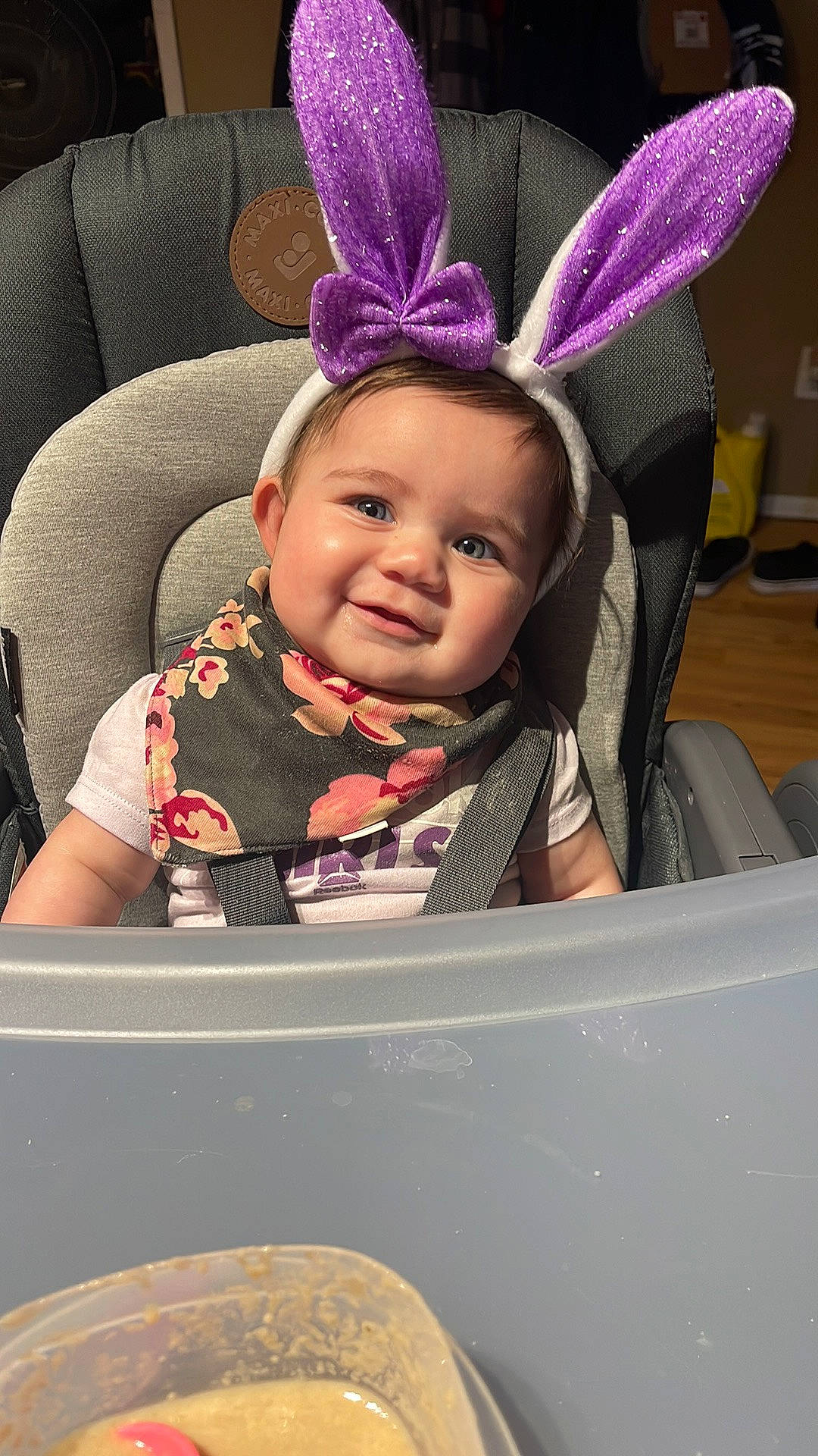 Estelle is registered to the contest to win money with this photo: baby, baby_toddler_clothing, car_seat, cheek, child, comfort, costume_hat, fashion_accessory, happy, headband, headgear, joy, magenta, organ, person, pink, purple, sitting, smile, toddler