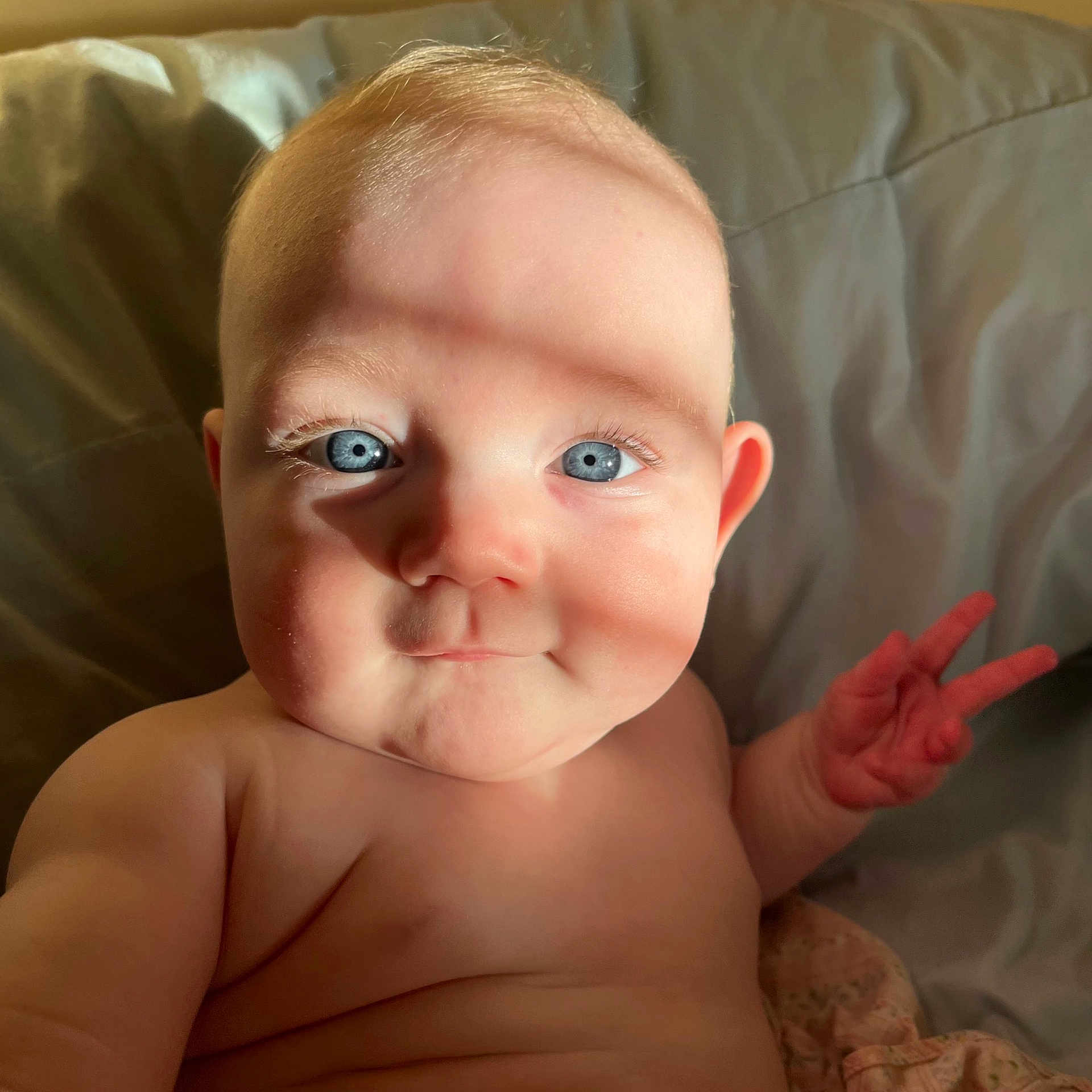 River is registered to the contest to win money with this photo: arm, cheek, chin, ear, eye, eyebrow, eyelash, forehead, gesture, hand, head, human_body, iris, jaw, lip, mouth, muscle, neck, nose, skin