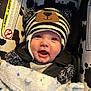 Jaxson is registered to the contest to win money with this photo: baby, infant, car_seat, hat, striped_hat, bear_ears, blanket, smiling, happy, face, child, cozy, cute, blue_blanket, black_and_white, car_safety, indoor, portrait, closeup, child_safety