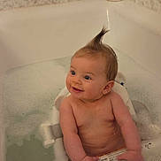 Gianna is registered to the contest to win money with this photo: baby, bathtub, bath_bubbles, baby_seat, moisturized_skin, happy_baby, bath_product, moisturizer, bathroom, child, water, foam, hair_spike, smiling, infant, sitting, clean, skin, cute, indoor