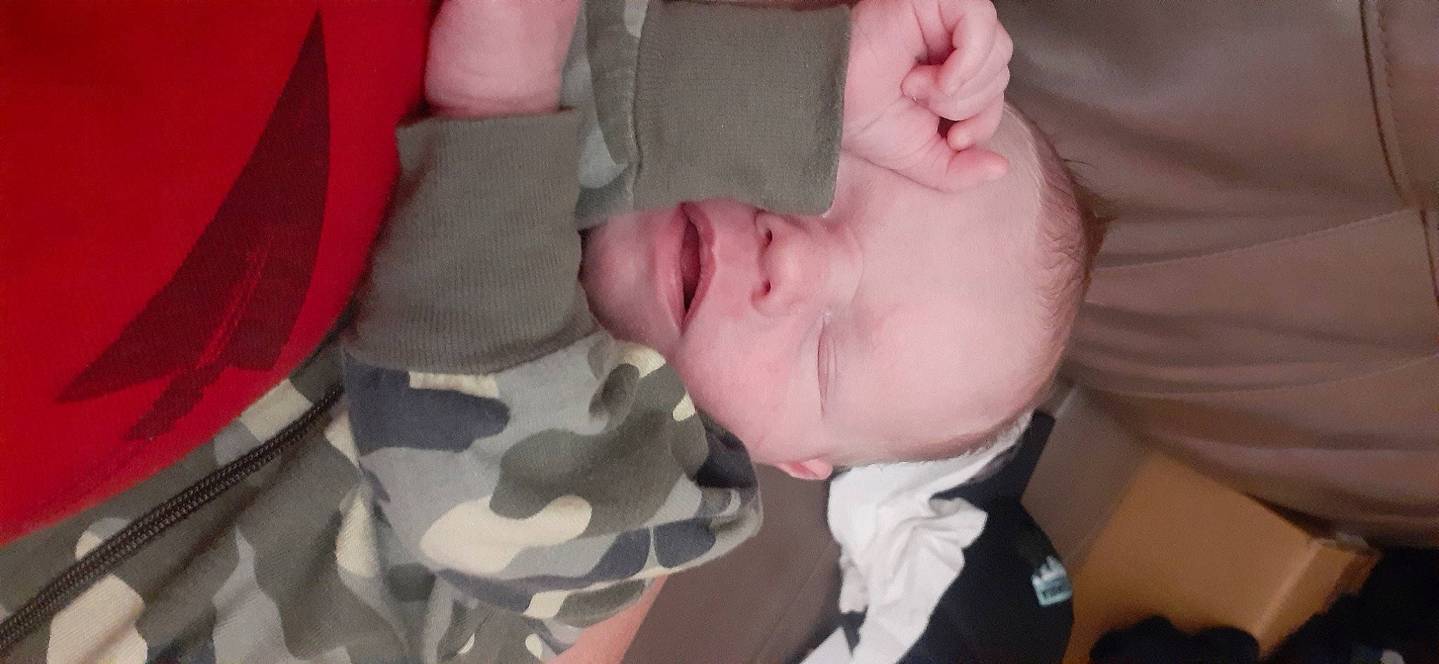 Kevin is registered to the contest to win money with this photo: baby, camouflage, cheek, comfort, eyelash, finger, gesture, happy, headgear, leg, lip, military_camouflage, mouth, nail, nose, pattern, person, pink, textile, thumb