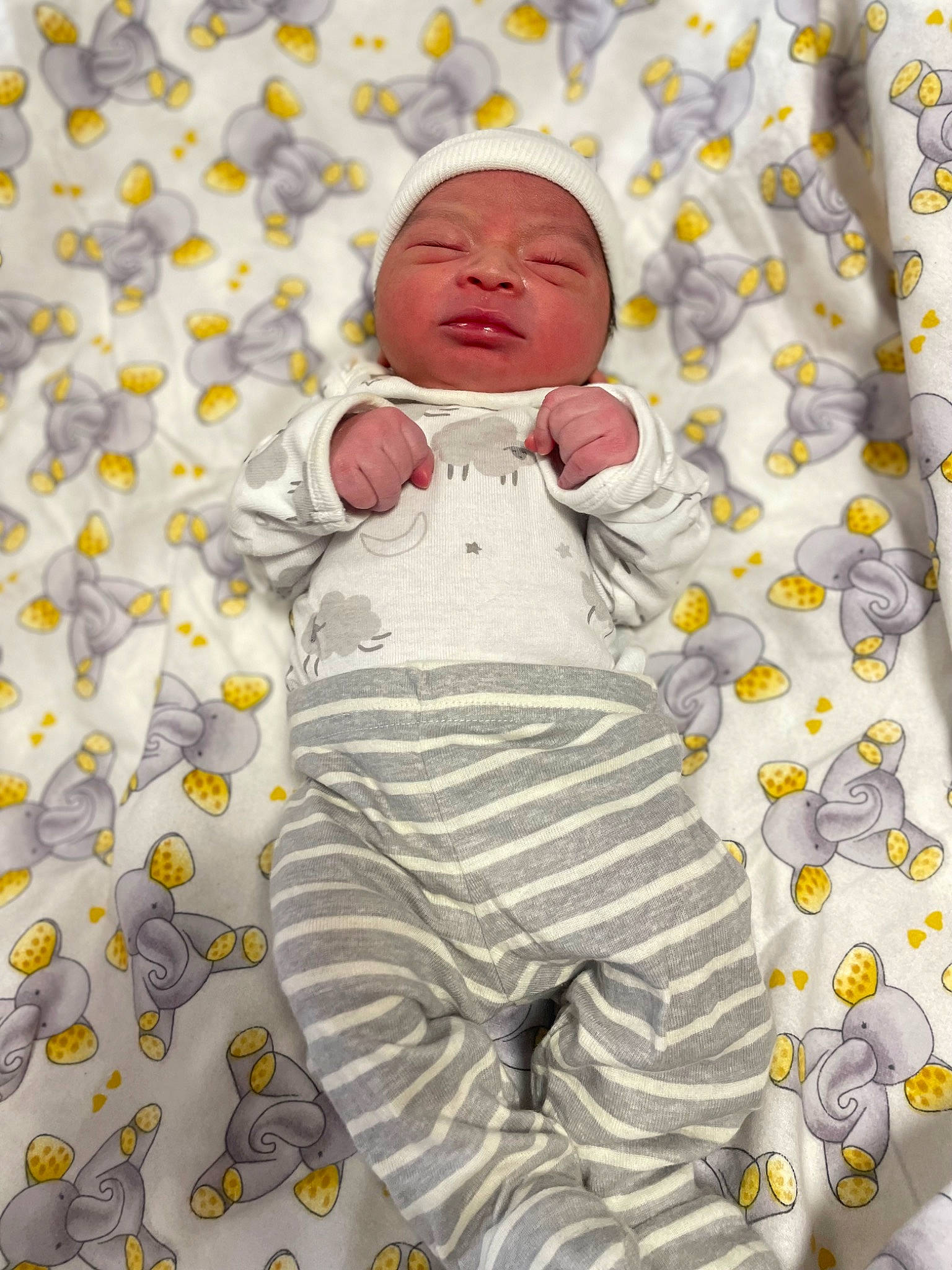 Noah is registered to the contest to win money with this photo: baby, baby_products, baby_sleeping, baby_toddler_clothing, bed_sheet, bedding, child, comfort, design, face, flooring, grass, happy, head, headwear, illustration, linens, logo, pattern, people_in_nature