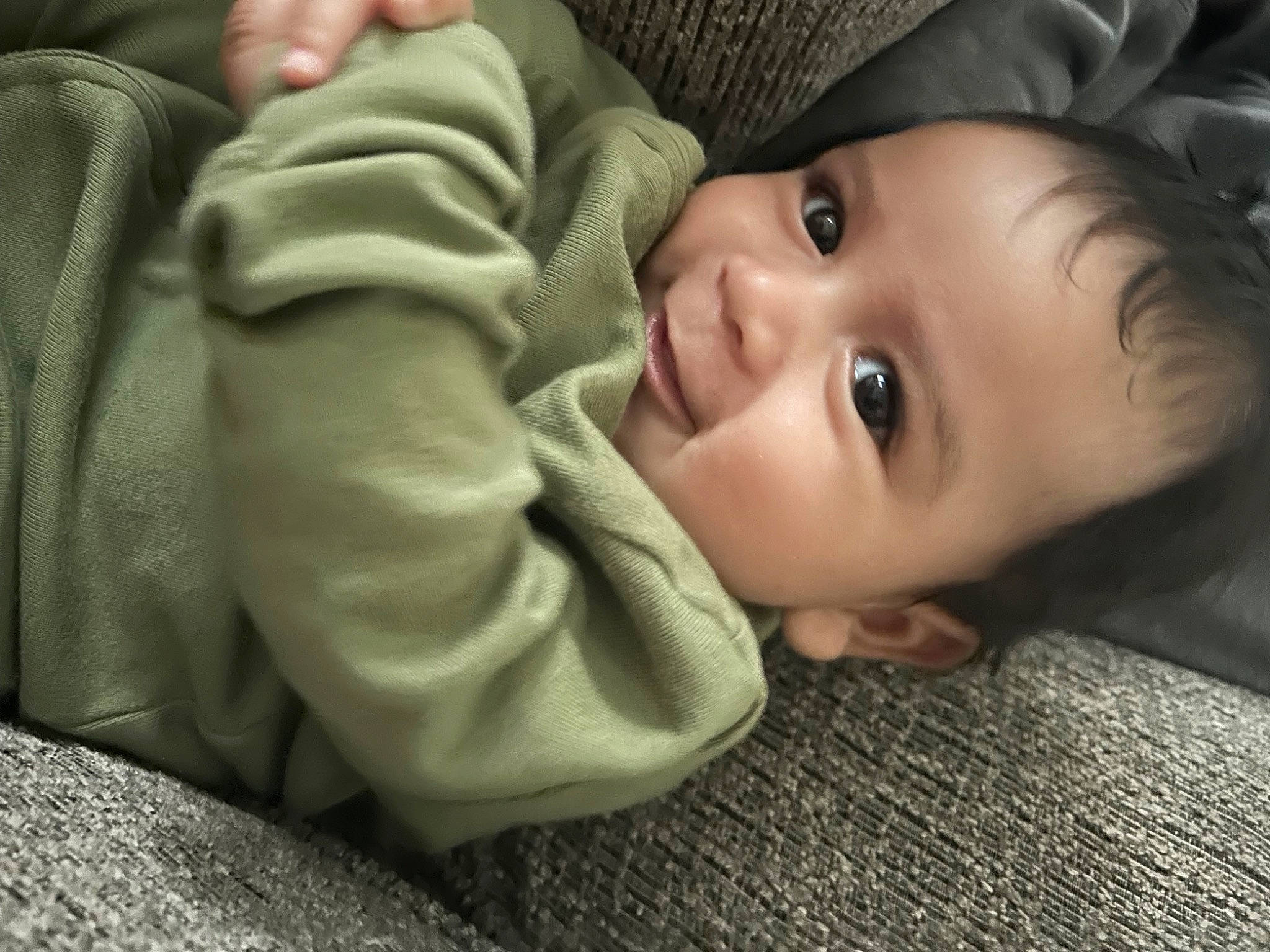 Noah joined the competition — help win amazing prizes! baby, baby_toddler_clothing, cheek, child, comfort, eyelash, flash_photography, flooring, grass, iris, mouth, nose, person, portrait_photography, sitting, skin, smile, thumb, toddler, wood