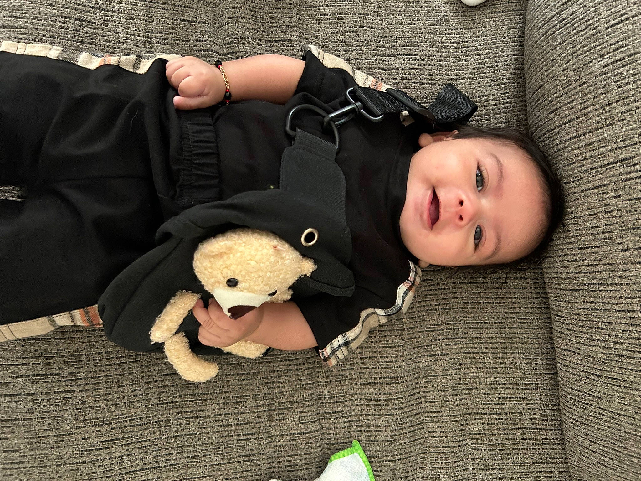 Noah is registered to the contest to win money with this photo: baby, baby_toddler_clothing, child, comfort, doll, eye, flash_photography, grass, head, headgear, mammal, person, sitting, skin, sleeve, smile, stuffed_toy, toddler, toy, wood