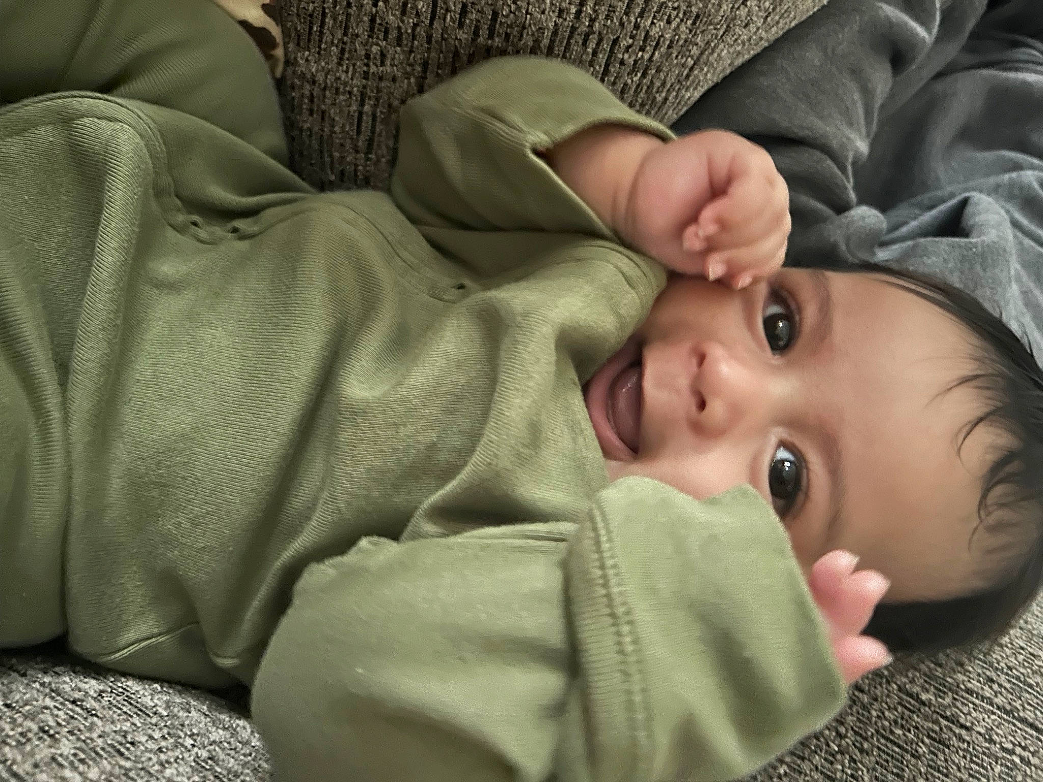 Noah is registered to the contest to win money with this photo: baby, baby_toddler_clothing, cheek, child, comfort, eye, eyelash, face, grass, head, linens, nose, person, portrait_photography, sitting, skin, sleeve, smile, toddler, vertebrate