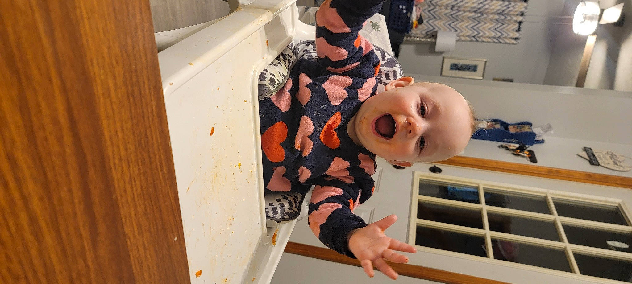 Ramona is registered to the contest to win money with this photo: arm, baby, child, computer_keyboard, eyewear, fun, hat, input_device, office_equipment, peripheral, person, room, sleeve, space_bar, sunglasses, t_shirt, toddler, toy, window, wood