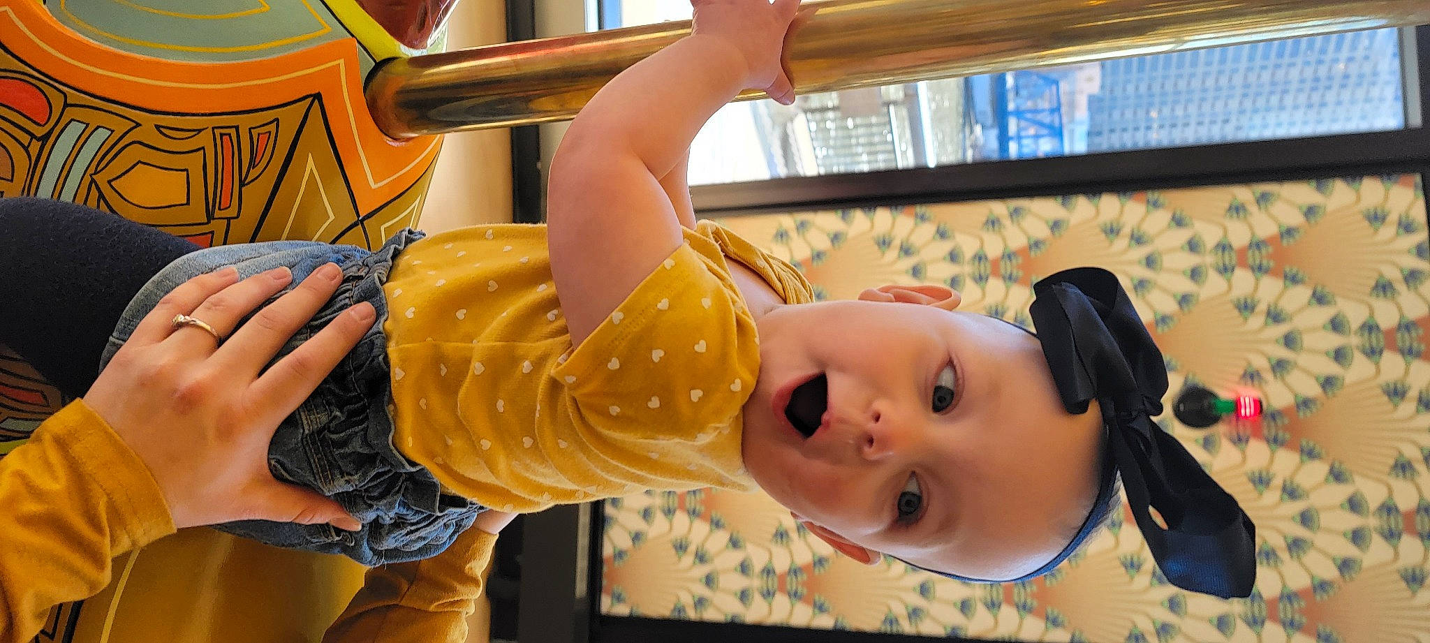 Ramona is registered to the contest to win money with this photo: abdomen, audio_equipment, baby, child, eyelash, fun, happy, headwear, human_leg, leisure, person, recreation, room, shorts, sunglasses, surprise, thigh, toddler, vacation, vehicle_door