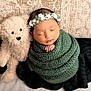 Taashvi joined the competition — help win amazing prizes! newborn, baby, sleeping, teddy_bear, knitted_blanket, floral_headband, pillow, cozy, cute, infant, soft_toy, wrapped, portrait, peaceful, child, indoors, resting, baby_sleep, adorable, comfort