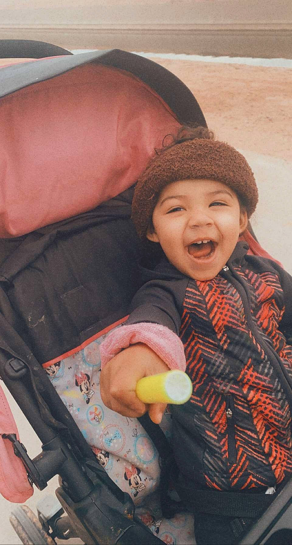 Maliah is registered to the contest to win money with this photo: baby, baby_laughing, baby_products, baby_toddler_clothing, beanie, bonnet, comfort, headwear, knit_cap, laugh, leather, person, toddler, tongue, tooth, wool