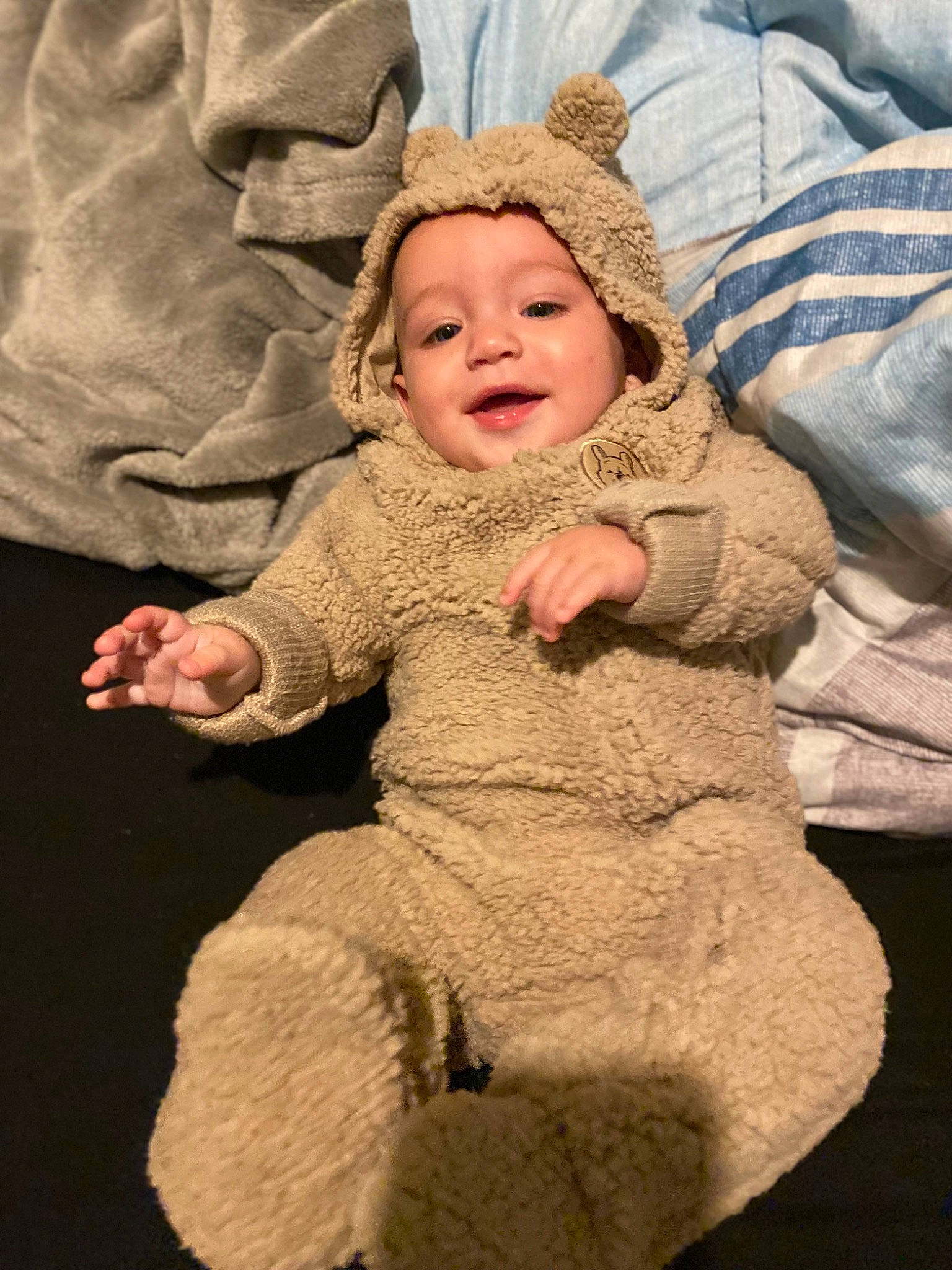 Cylus is registered to the contest to win money with this photo: baby, baby_toddler_clothing, cheek, child, comfort, eye, face, fun, fur, gesture, grass, happy, hat, headwear, laugh, nose, person, sitting, skin, sleeve