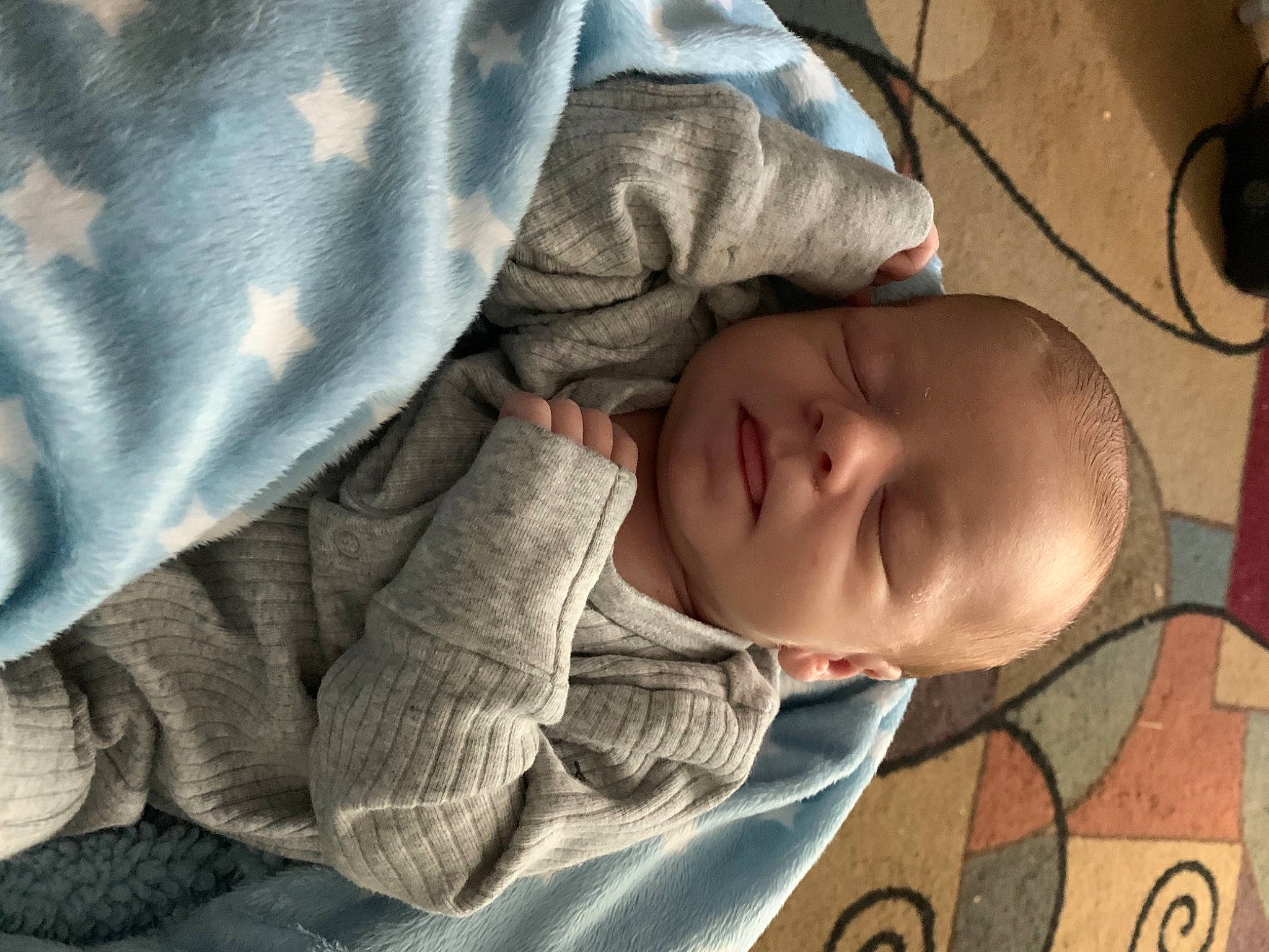 Cameron joined the competition — help win amazing prizes! baby, baby_toddler_clothing, bedtime, cheek, child, comfort, flooring, grey, linens, nap, pattern, person, sitting, sleep, sleeve, toddler, vertebrate, wood