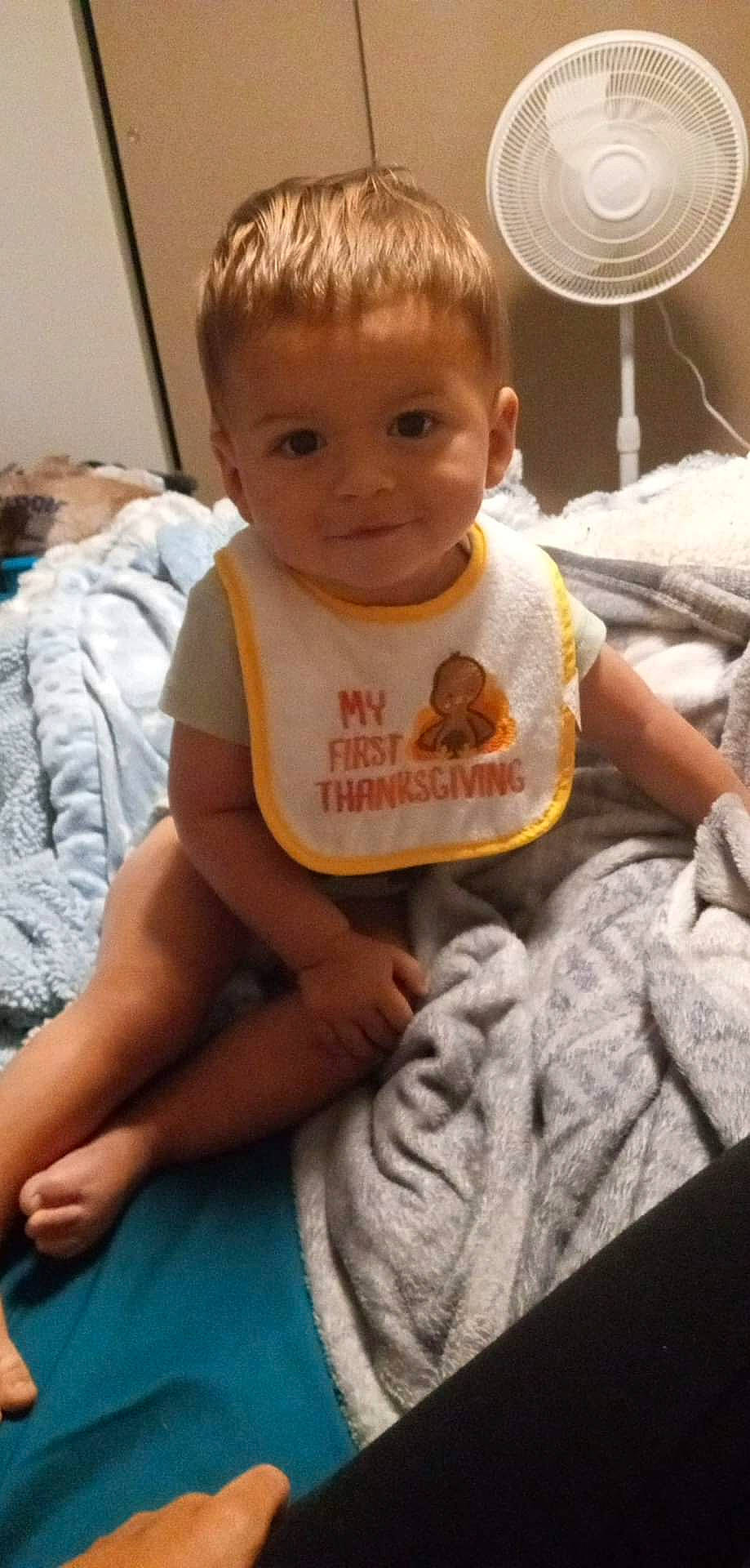 Cameron is registered to the contest to win money with this photo: baby, baby_toddler_clothing, cheek, child, comfort, eye, face, finger, happy, head, iris, mammal, mouth, nose, person, sitting, skin, sleeve, smile, t_shirt