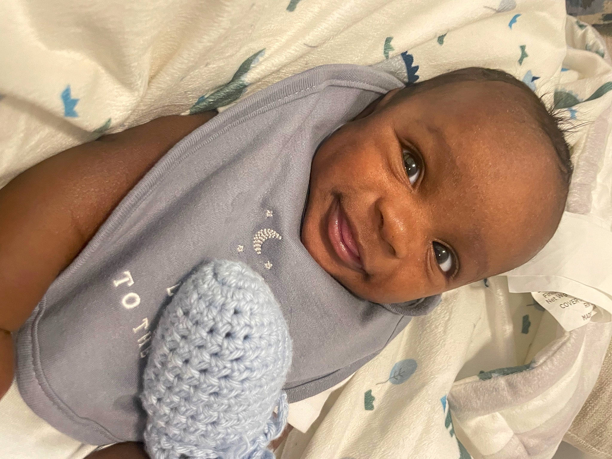 Cameron is registered to the contest to win money with this photo: baby, baby_products, baby_sleeping, child, comfort, face, happy, human_body, linens, lip, mouth, nose, person, room, skin, sleeve, smile, textile, toddler, white