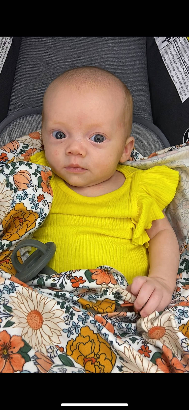 Aphora is registered to the contest to win money with this photo: baby, baby_toddler_clothing, black, cheek, child, dress, eye, face, happy, head, iris, orange, pattern, person, product, skin, sleeve, textile, toddler, white