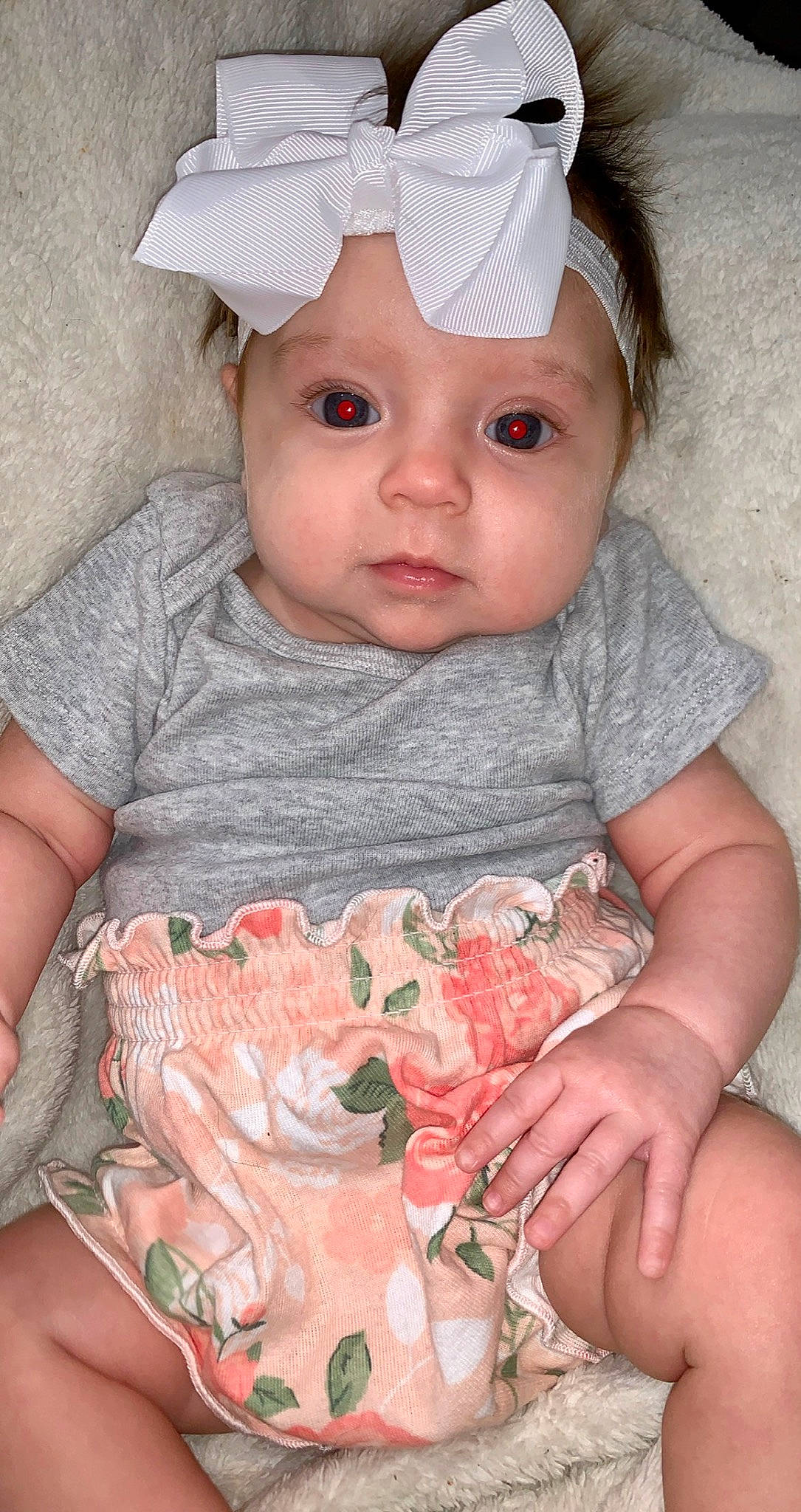 Margot is registered to the contest to win money with this photo: baby_toddler_clothing, cap, cheek, chin, dress, eye, face, facial_expression, hand, head, headwear, human, human_body, lip, mouth, neck, nose, organ, person, skin