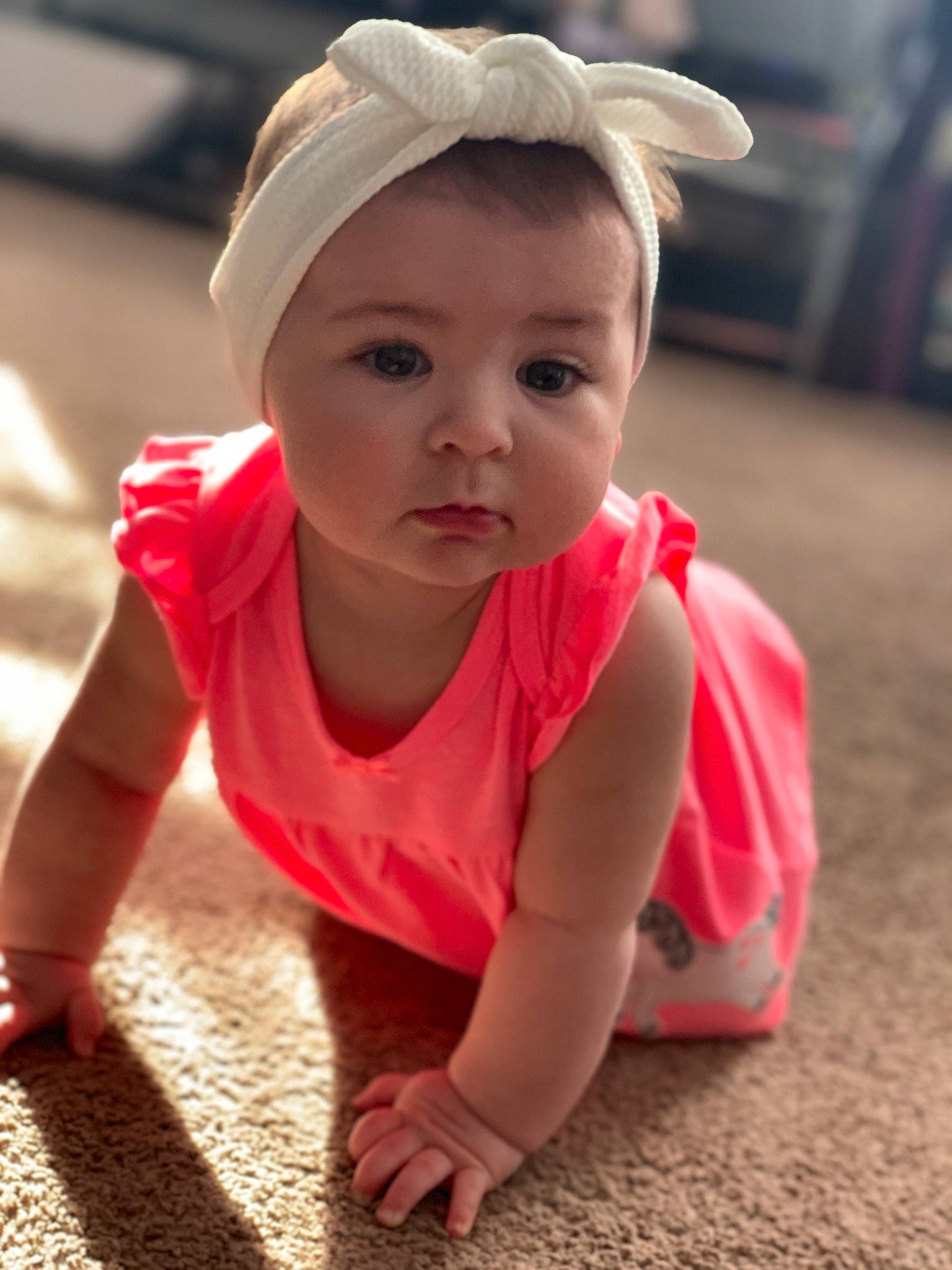 Aurora is registered to the contest to win money with this photo: asphalt, baby, baby_toddler_clothing, cap, child, crawling, facial_expression, floor, flooring, fun, grass, happy, headgear, headwear, person, pink, road_surface, skin, sleeve, smile