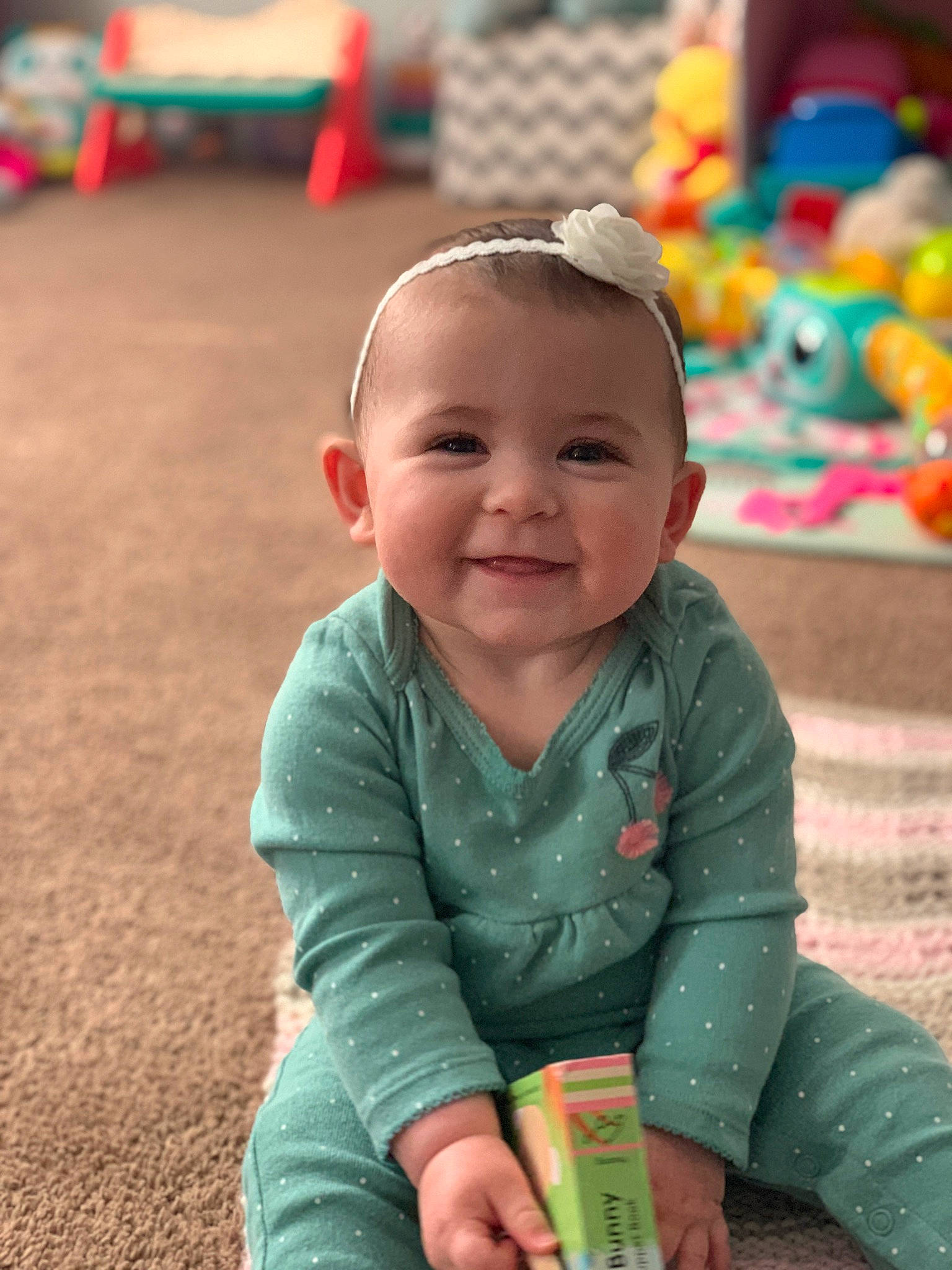 Aurora is registered to the contest to win money with this photo: baby, baby_playing_with_toys, baby_toddler_clothing, blue, cheek, child, chin, eye, grass, green, happy, head, iris, joy, leisure, person, photograph, pink, product, skin