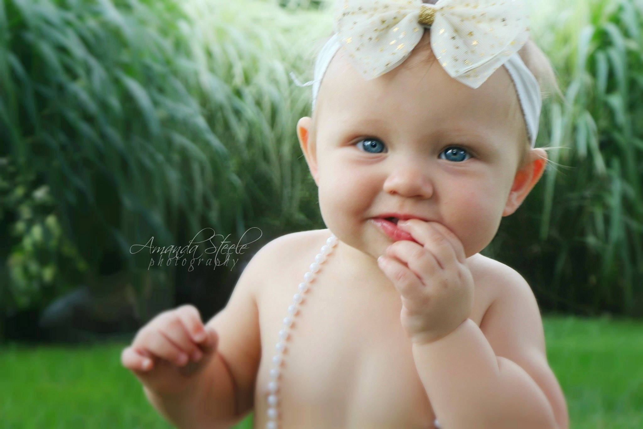 Harper Grace is registered to the contest to win money with this photo: cheek, child, eye, girl, grass, hair_accessory, hand, happiness, infant, iris, joy, meadow, person, portrait_photography, skin, smile, toddler