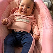 Haiti joined the competition — help win amazing prizes! baby, infant, smiling, pink, clothing, pants, sitting, cushion, seat, indoor, person, child, cute, happy, face, portrait, cozy, soft, comfort, home