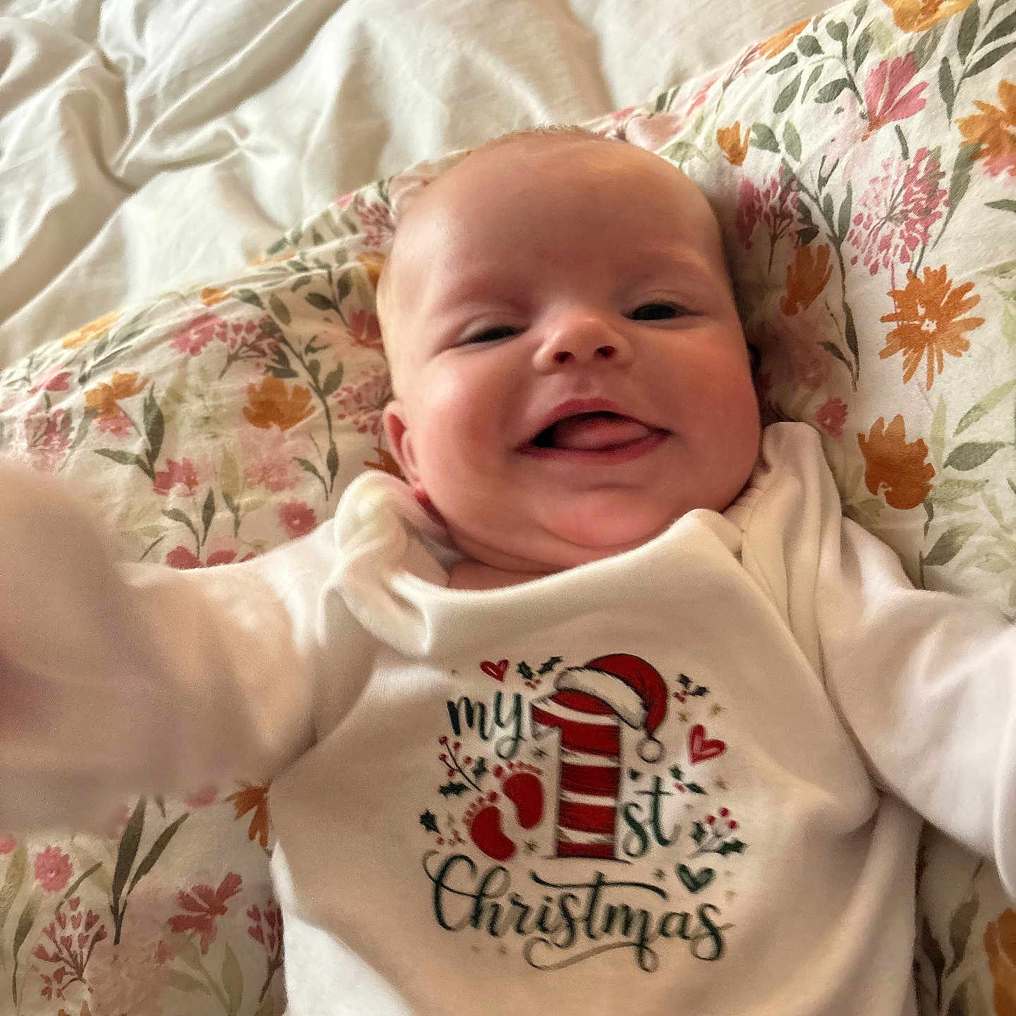 Charity Sky joined the competition — help win amazing prizes! baby, blanket, celebration, child, christmas, clothing, cute, face, floral, happy, head, holiday, indoors, infant, lying_down, onesie, pillow, portrait, skin, smiling