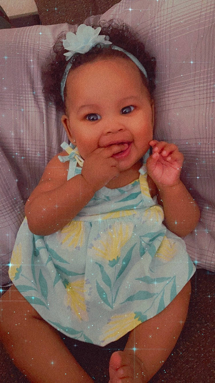 Jaìonni is registered to the contest to win money with this photo: baby_toddler_clothing, cheek, chin, dress, eye, eyebrow, face, finger, gesture, hairstyle, happy, head, iris, neck, nose, organ, person, pink, skin, sleeve