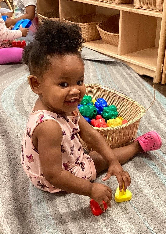 Jaìonni joined the competition — help win amazing prizes! baby, baby_playing_with_toys, baby_products, bathing, child, event, floor, flooring, fun, happy, leisure, party, person, play, recreation, room, shelf, sitting, smile, toddler