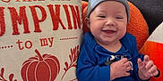Abel joined the competition — help win amazing prizes! baby, smiling, couch, pillow, striped_clothing, hat, infant, indoor, decor, pumpkin, orange, blue_clothing, child, happy, cozy, portrait, home, sitting, cute, seasonal