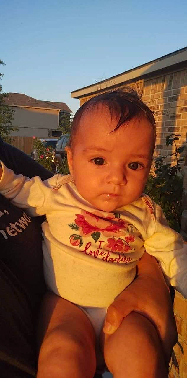 Izadora joined the competition — help win amazing prizes! baby, baby_toddler_clothing, bib, cheek, chest, child, finger, fun, gesture, happy, lip, nose, orange, person, sitting, skin, sky, t_shirt, thumb, toddler