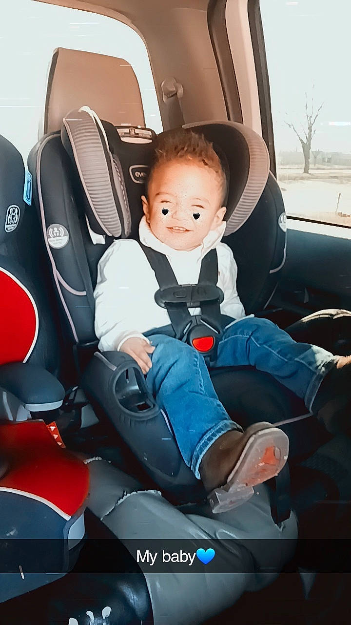 Brian is registered to the contest to win money with this photo: auto_part, automotive_design, automotive_exterior, car, car_seat, car_seat_cover, comfort, electric_blue, family_car, head_restraint, luxury_vehicle, mode_of_transport, motor_vehicle, person, personal_luxury_car, seat_belt, smile, steering_part, toddler, vehicle