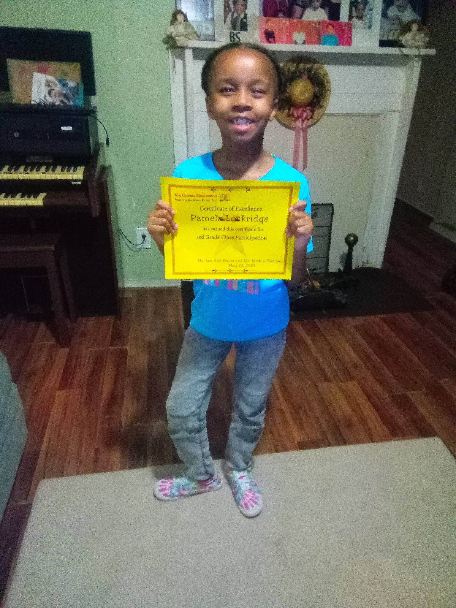 Pamela is registered to the contest to win money with this photo: child, event, floor, flooring, fun, handwriting, hardwood, home_appliance, jeans, joy, kindergarten, kitchen_appliance, person, play, recreation, refrigerator, room, smile, t_shirt, toddler