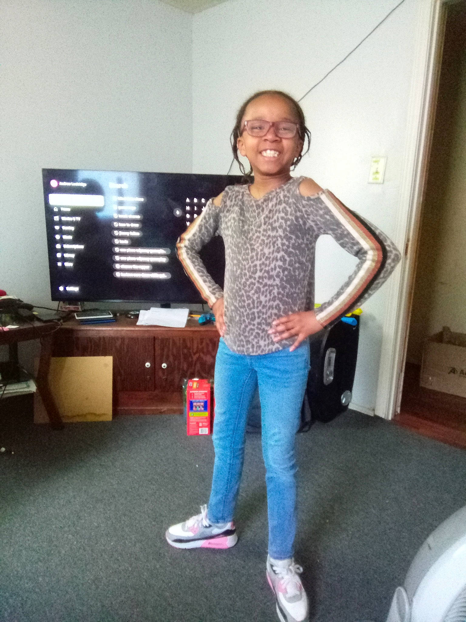 Pamela joined the competition — help win amazing prizes! balance, child, denim, display_device, electric_blue, flooring, fun, human_leg, joint, joy, knee, led_backlit_lcd_display, leg, leisure, person, room, smile, sneakers, sportswear, t_shirt