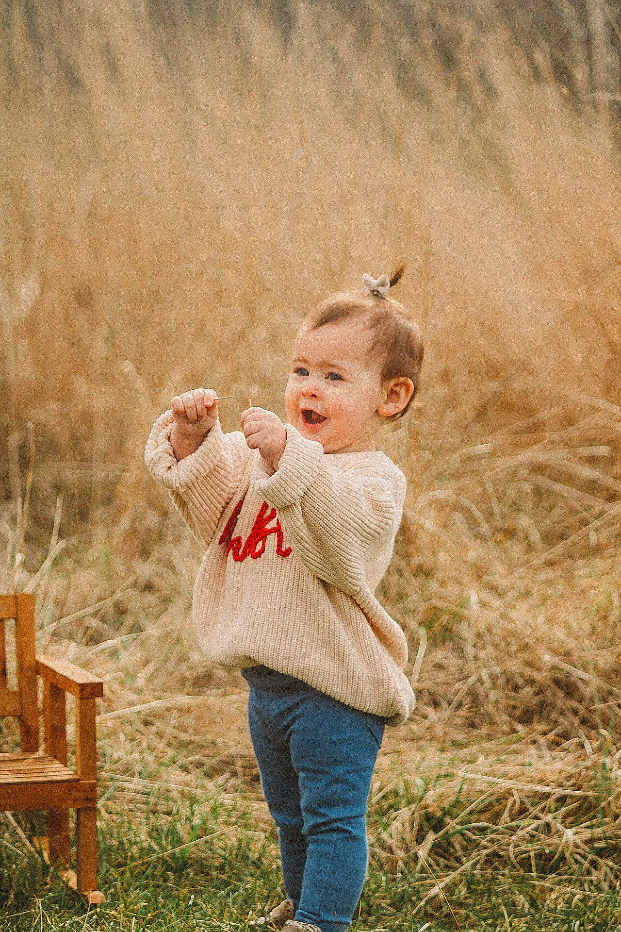 Rubii is registered to the contest to win money with this photo: baby, child, field, flash_photography, fun, gesture, grass, grassland, happy, landscape, leisure, meadow, people_in_nature, person, play, portrait_photography, prairie, recreation, sitting, soil