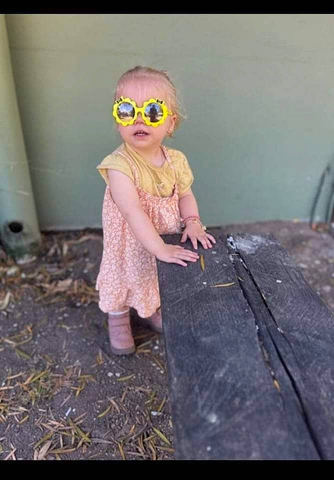 Poppie joined the competition — help win amazing prizes! doll, eyewear, fashion_design, flash_photography, glasses, goggles, grass, happy, magenta, pattern, person, personal_protective_equipment, sitting, sunglasses, tints_and_shades, toddler, toy, tree, vintage_clothing, vision_care