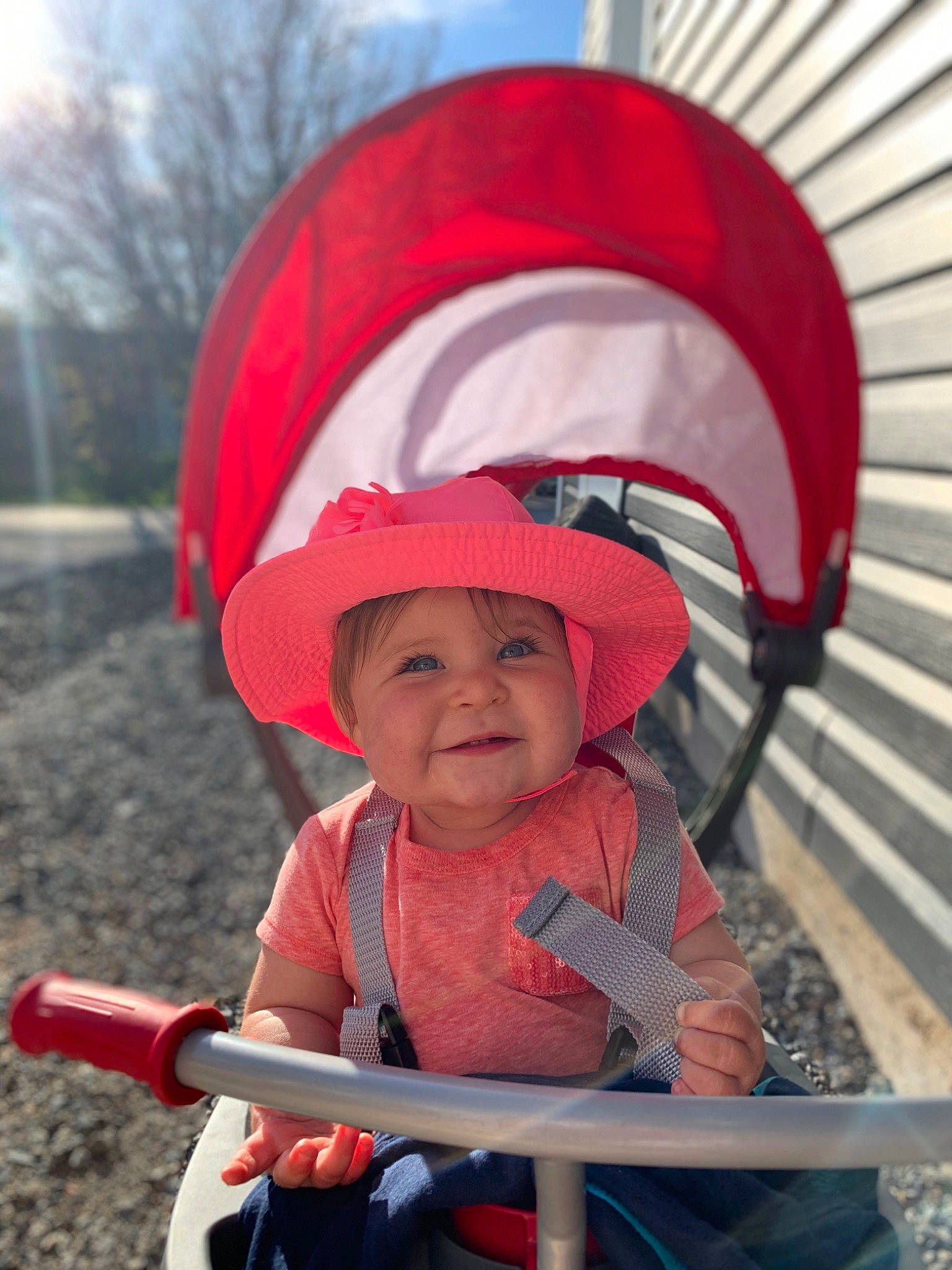Harlie is registered to the contest to win money with this photo: child, fashion_accessory, fictional_character, hat, headgear, headwear, joy, person, product, red, smile, sun_hat, toddler, vehicle