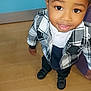 Kayden joined the competition — help win amazing prizes! child, toddler, smiling, plaid_jacket, black_shoes, wooden_floor, blue_wall, standing, looking_up, cute, portrait, indoors, person, happy, casual_clothing, short_hair, fashion, young_child, black_hair, eyes