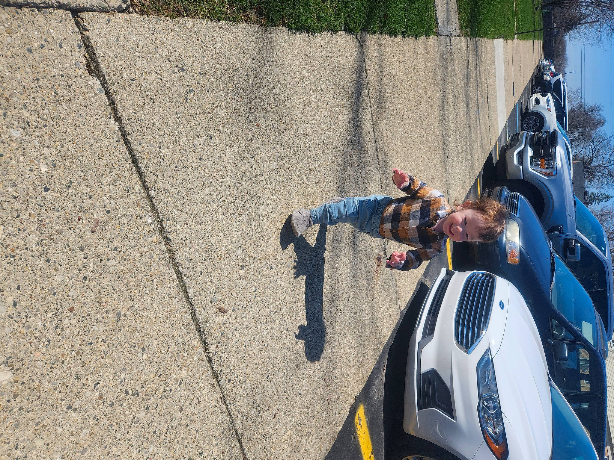 Zechariah joined the competition — help win amazing prizes! asphalt, auto_part, automotive_design, automotive_exterior, automotive_lighting, automotive_tire, automotive_wheel_system, fender, headlamp, helmet, joy, motor_vehicle, person, personal_protective_equipment, plant, rim, road, road_surface, tire, tree