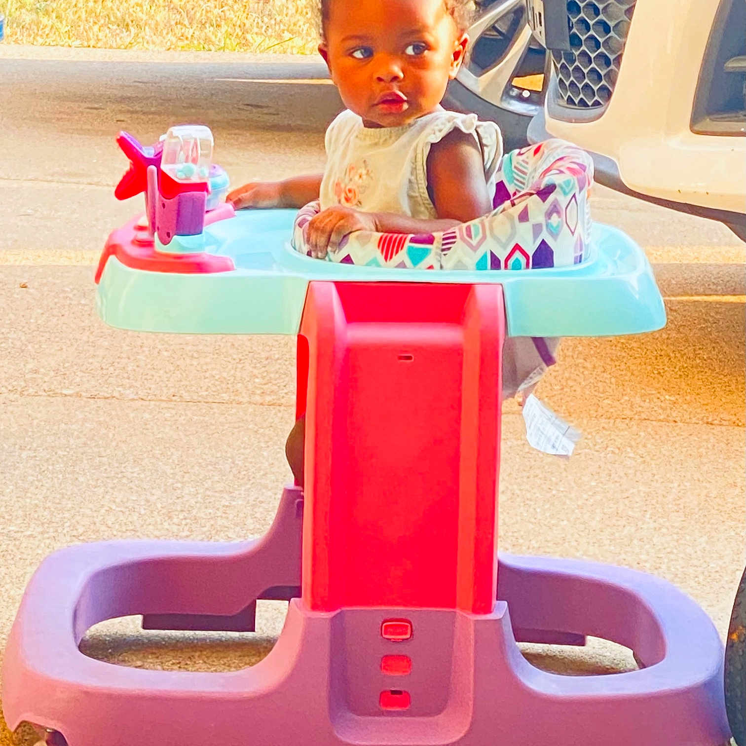 Iriè is registered to the contest to win money with this photo: baby, chair, desk, diningtable, face, furniture, head, highchair, machine, outdoorplayarea, outdoors, person, photography, play, playarea, portrait, sitting, table, transportation, wheel